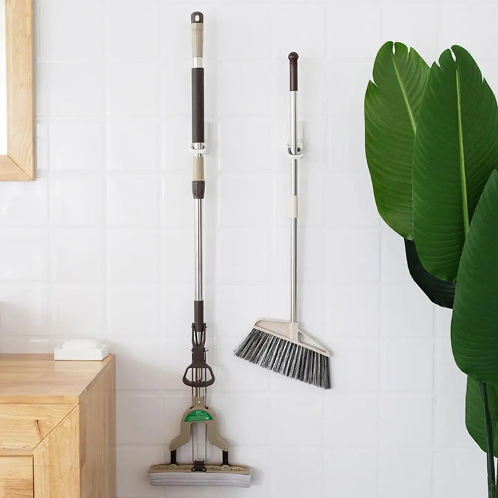 Peeling stick mop holder for laundry rooms
